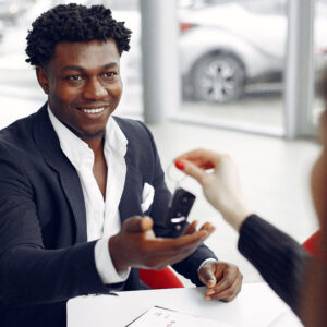 stylish black man buying new car